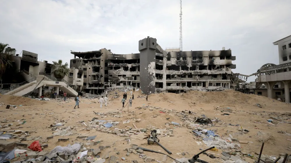 Rescuers and medics search for dead bodies inside the damaged Al Shifa Hospital after Israeli forces withdrew from the hospital and the area around it following a two-week operation, amid the ongoing conflict between Israel and Hamas, in Gaza City April 8, 2024. REUTERS/Dawoud Abu Alkas