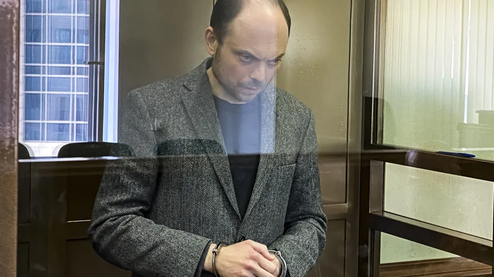 In this handout photo released by the Moscow City Court, Russian opposition activist Vladimir Kara-Murza stands in a class cage in a courtroom at the Moscow City Court in Moscow, on April 17, 2023. The 25-year treason sentence imposed on prominent Russian opposition figure Vladimir Kara-Murza on Monday was a particularly severe show of authorities' intensifying intolerance of criticism of the war in Ukraine and other dissenting opinions. (The Moscow City Court via AP)