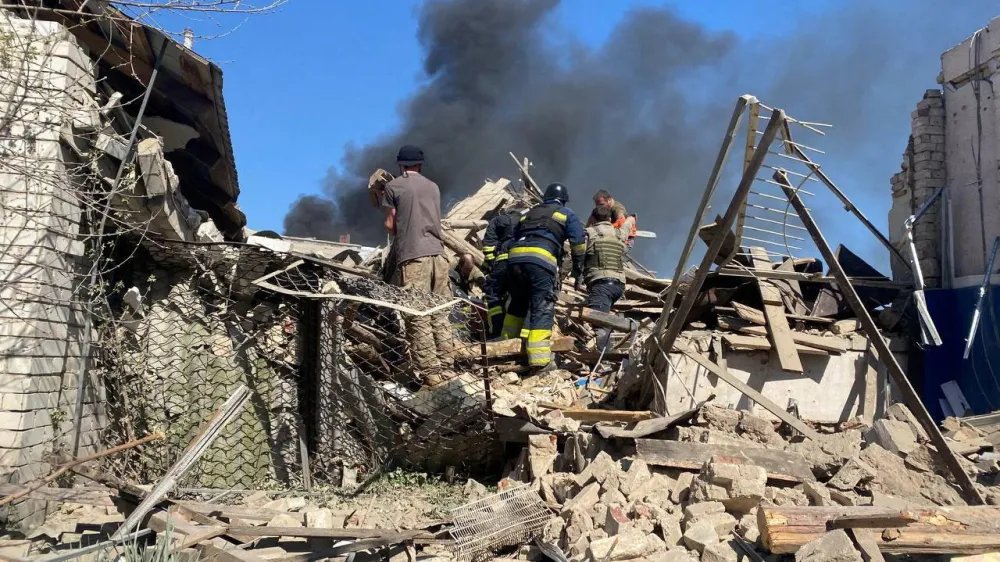 Rescuers and police work the site of a residential building destroyed during Russian air strikes, amid Russia's attack on Ukraine, in the village of Lyptsi, Kharkiv region, Ukraine April 10, 2024. Head of Kharkiv Regional-Military Administration Oleh Syniehubov via Telegram/Handout via REUTERS ATTENTION EDITORS - THIS IMAGE HAS BEEN SUPPLIED BY A THIRD PARTY. NO RESALES. NO ARCHIVES.