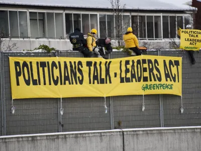 Greenpeace activists display banners on the route between Copenhagen airport and the Bella Centre during the U.N. climate change talks in Copenhagen December 17, 2009. About 120 U.N. world leaders are aiming to try to end deadlock at a U.N. climate summit in Copenhagen that is meant to agree a new deal on Friday for fighting global warming. REUTERS/Christian Aslund/Greenpeace/Handout (DENMARK - Tags: CIVIL UNREST ENVIRONMENT) FOR EDITORIAL USE ONLY. NOT FOR SALE FOR MARKETING OR ADVERTISING CAMPAIGNS. NO SALES. NO ARCHIVES