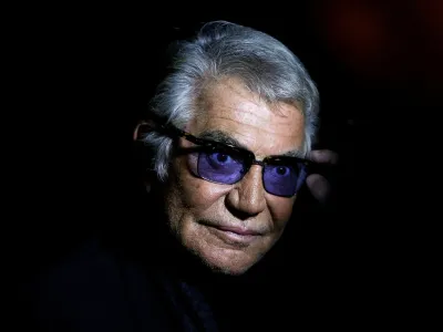 FILE PHOTO: Italian designer Roberto Cavalli poses before the start of his Spring/Summer 2014 collection during Milan Fashion Week September 21, 2013. REUTERS/Max Rossi/File Photo