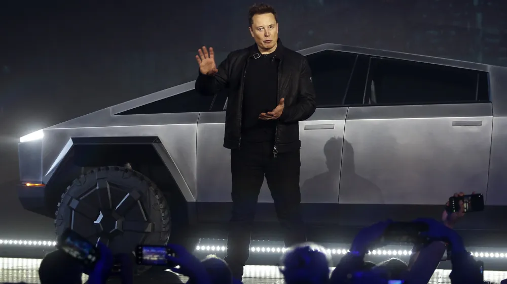 ﻿Tesla CEO Elon Musk introduces the Cybertruck at Tesla's design studio Thursday, Nov. 21, 2019, in Hawthorne, Calif. Musk is taking on the workhorse heavy pickup truck market with his latest electric vehicle. (AP Photo/Ringo H.W. Chiu)