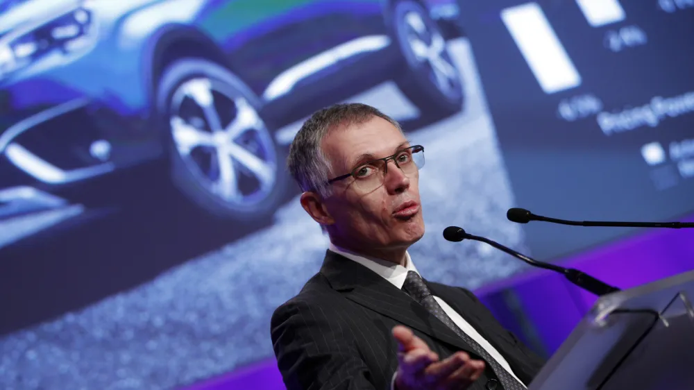 ﻿PSA Peugeot Citroen Chief Executive Carlos Tavares delivers his speech during the presentation of the company's 2016 full year results, in Paris, Thursday, Feb.23, 2017. French carmaker PSA Group saw its profits jump last year and is giving dividends for the first time since 2011, burnishing its image as it weighs a buyout of General Motors' money-losing European operations. (AP Photo/Christophe Ena)