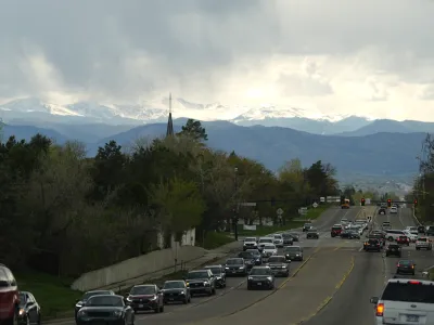 Rain clouds roll off the Rocky Mountains as motorists slog through evening rush hour traffic eastbound on Hampden Avenue Friday, April 26, 2024, in southeast Denver. Forecasters are predicting that a spring storm will dump rain along the Front Range and snow in some mountain locations before moving on to the Great Plains. (AP Photo/David Zalubowski)