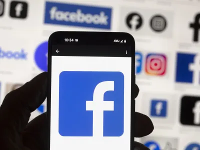 FILE - The Facebook logo is seen on a cell phone in Boston, USA, Oct. 14, 2022. Users of Meta's Facebook, Instagram, Threads and Messenger platforms are experiencing login issues in what appears to be a widespread outage. (AP Photo/Michael Dwyer, File)