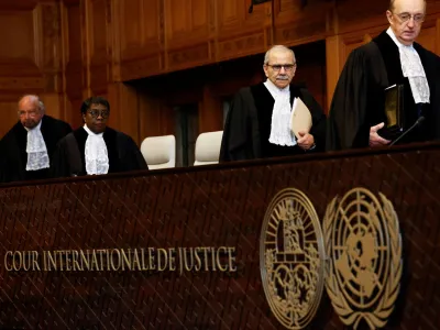 Judge Nawaf Salam, president of the International Court of Justice (ICJ), and other judges walk as they attend a public hearing where Mexico is set to ask the International Court of Justice (ICJ) to issue emergency measures against Ecuador over the armed raid on the Mexican embassy, which Mexico says is a violation of international law, in The Hague, Netherlands, April 30, 2024. REUTERS/Piroschka van de Wouw