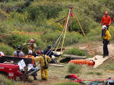 Members of a rescue team work at a site where three bodies were found in the state of Baja California where one American and two Australian tourists were reported missing, in La Bocana, Mexico May 3, 2024. REUTERS/Francisco Javier Cruz