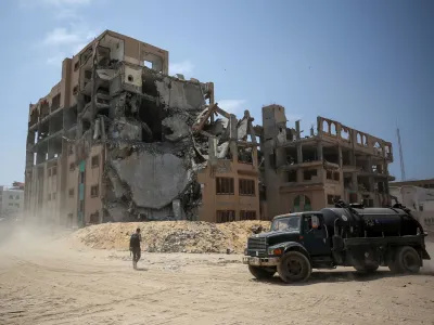 A truck moves pas the Islamic University of Gaza (IUG), which was destroyed during Israel's military offensive, amid the ongoing conflict between Israel and the Palestinian Islamist group Hamas, in Gaza City April 28, 2024. REUTERS/Dawoud Abu Alkas