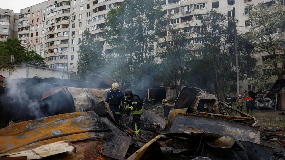 Firefighters work at a site of a Russian air strike, amid Russia's attack on Ukraine, in Kharkiv, Ukraine May 14, 2024. REUTERS/Valentyn Ogirenko