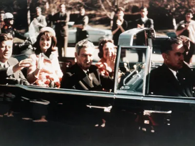 Prior to the assassination, President John F Kennedy, First Lady Jacqueline Kennedy, and Texas Governor John Connally ride through the streets of Dallas, Texas on November 22, 1963. Included as an exhibit for the Warren Commission. (Photo by © CORBIS/Corbis via Getty Images)