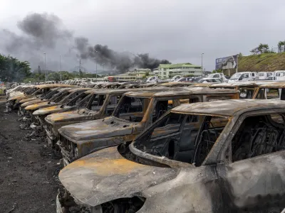 Burnt cars are lined up after unrest that erupted following protests over voting reforms in Noumea, New Caledonia, Wednesday, May 15, 2024. (AP Photo/Nicolas Job)