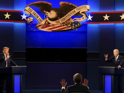 Moderator Chris Wallace of Fox News as well as President Donald Trump and Democratic candidate former Vice President Joe Biden during the first presidential debate Tuesday, Sept. 29, 2020, at Case Western University and Cleveland Clinic, in Cleveland, Ohio. (AP Photo/Patrick Semansky)