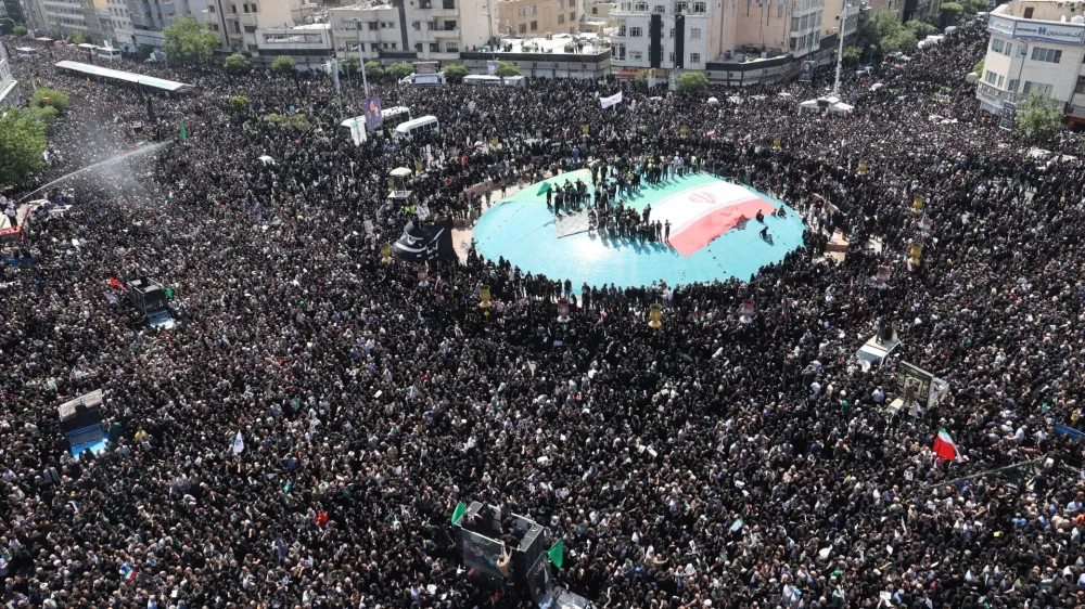 Mourners attend a funeral for victims of the helicopter crash that killed Iran's President Ebrahim Raisi, Foreign Minister Hossein Amirabdollahian and others, in Tehran, Iran, May 22, 2024. Majid Asgaripour/WANA (West Asia News Agency) via REUTERS ATTENTION EDITORS - THIS PICTURE WAS PROVIDED BY A THIRD PARTY