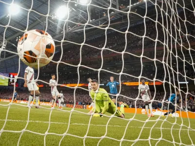 Atalanta's Ademola Lookman, right, scores his side's third goal during the Europa League final soccer match between Atalanta and Bayer Leverkusen at the Aviva Stadium in Dublin, Ireland, Wednesday, May 22, 2024. (AP Photo/Kirsty Wigglesworth)