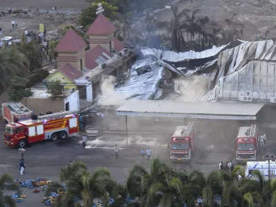 Firefighters douse a fire which broke out in a fun park, in Rajkot in the Indian state of Gujarat, Saturday, May 25, 2024. A massive fire broke out on Saturday in a fun park in western India, killing more than ten people and injuring some others, news reports said. (AP Photo/Chirag Chotaliya)