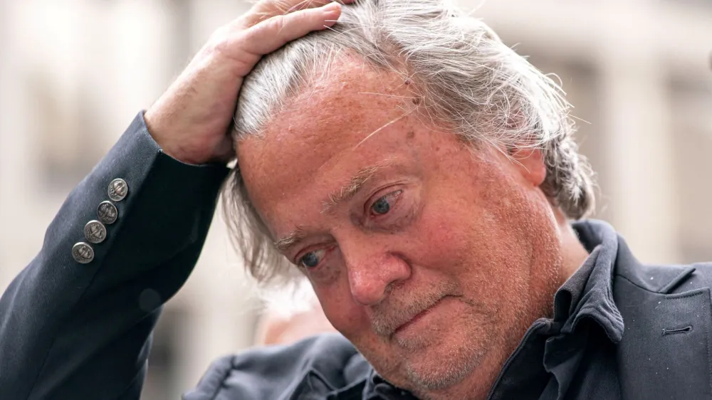 Former White House Chief Strategist Stephen Bannon gestures as he speaks to members of the media while leaving the federal courthouse after a judge ordered him to surrender by July 1 to begin serving his four-month prison term, Washington, U.S., June 6, 2024. REUTERS/Nathan Howard   TPX IMAGES OF THE DAY