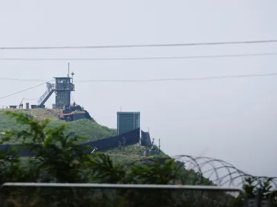 South Korean soldiers walk past a military facility (Green box) where loudspeakers dismantled in 2018 used to be, near the demilitarized zone separating the two Koreas in Paju, South Korea, June 10, 2024.  REUTERS/Kim Hong-Ji