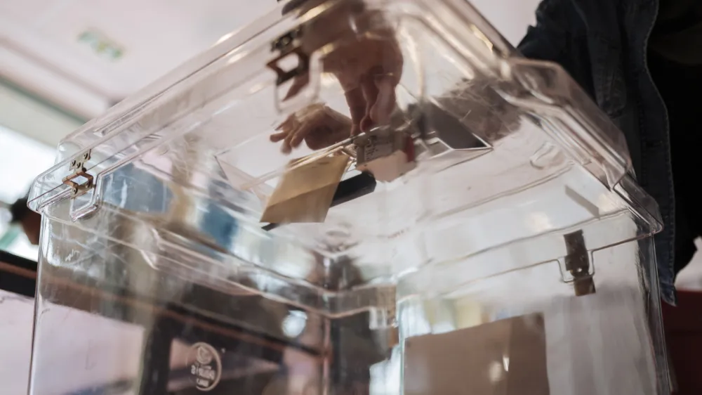 A woman casts her ballot for the European Parliament elections, Sunday, June 9, 2024 in Paris. Polling stations opened across Europe on Sunday as voters from 20 countries cast ballots in elections that are expected to shift the European Union's parliament to the right and could reshape the future direction of the world's biggest trading bloc. (AP Photo/Lewis Joly)