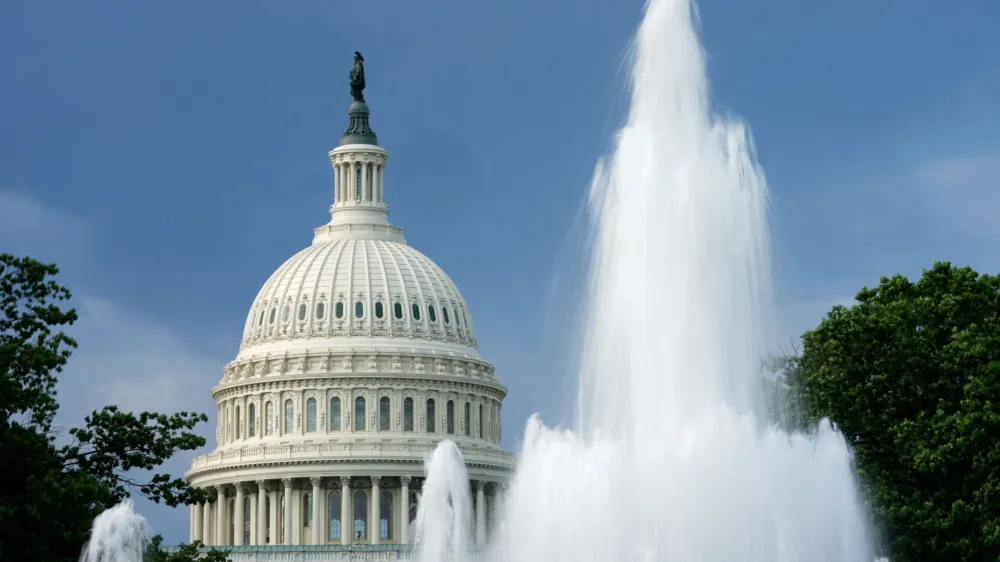 FILE PHOTO: The dome of the U.S. Capitol is seen beyond a fountain in Washington, U.S., August 12, 2022. REUTERS/Kevin Lamarque/File Photo