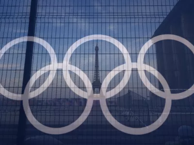 The Eiffel Tower is seen behind the Olympic rings, at the Trocadero plaza Thursday, July 18, 2024 in Paris. (AP Photo/David Goldman)