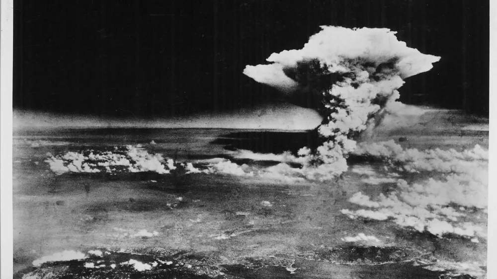 ﻿An atomic cloud billows above Hiroshima city following the explosion of the first atomic bomb to be used in warfare in Hiroshima, in this handout photo taken by the U.S. Army on August 6, 1945, and distributed by the Hiroshima Peace Memorial Museum. The words written on the photo are from the source. Mandatory credit REUTERS/U.S. Army/Hiroshima Peace Memorial Museum/Handout via Reuters TPX IMAGES OF THE DAYATTENTION EDITORS - THIS PICTURE WAS PROVIDED BY A THIRD PARTY. REUTERS IS UNABLE TO INDEPENDENTLY VERIFY THE AUTHENTICITY, CONTENT, LOCATION OR DATE OF THIS IMAGE. NO SALES. NO ARCHIVES. FOR EDITORIAL USE ONLY. NOT FOR SALE FOR MARKETING OR ADVERTISING CAMPAIGNS. MANDATORY CREDIT. THIS PICTURE IS DISTRIBUTED EXACTLY AS RECEIVED BY REUTERS, AS A SERVICE TO CLIENTS.