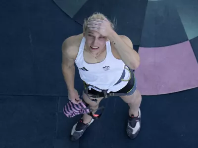 Janja Garnbret of Slovenia reacts after winning the gold during the women's boulder and lead final for the sport climbing competition at the 2024 Summer Olympics, Saturday, Aug. 10, 2024, in Le Bourget, France. (AP Photo/Christophe Ena, Pool)