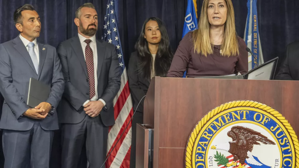 DEA Administrator Anne Milgram, at podium, joins U.S. Attorney Martin Estrada, far left, to announce five people have been charged in connection with Matthew Perry's death at a news conference in Los Angeles on Thursday, Aug. 15, 2024. (AP Photo/Damian Dovarganes)