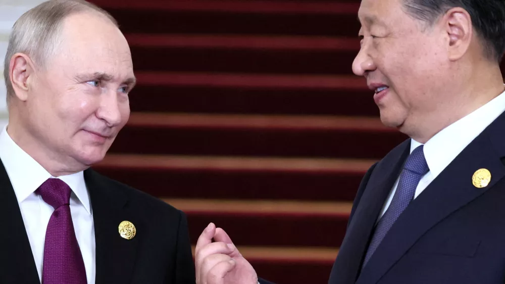 FILE PHOTO: Russian President Vladimir Putin speaks with Chinese President Xi Jinping during a welcoming ceremony at the Belt and Road Forum in Beijing, China, October 17, 2023. Sputnik/Sergei Savostyanov/Pool via REUTERS ATTENTION EDITORS - THIS IMAGE WAS PROVIDED BY A THIRD PARTY./File Photo