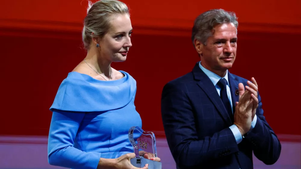 Slovenian Prime Minister Robert Golob applauds next to Yulia Navalnaya, the widow of late Russian opposition leader Alexei Navalny, during the 2024 edition of the Bled Strategic Forum in Slovenia, September 2, 2024. REUTERS/Borut Zivulovic
