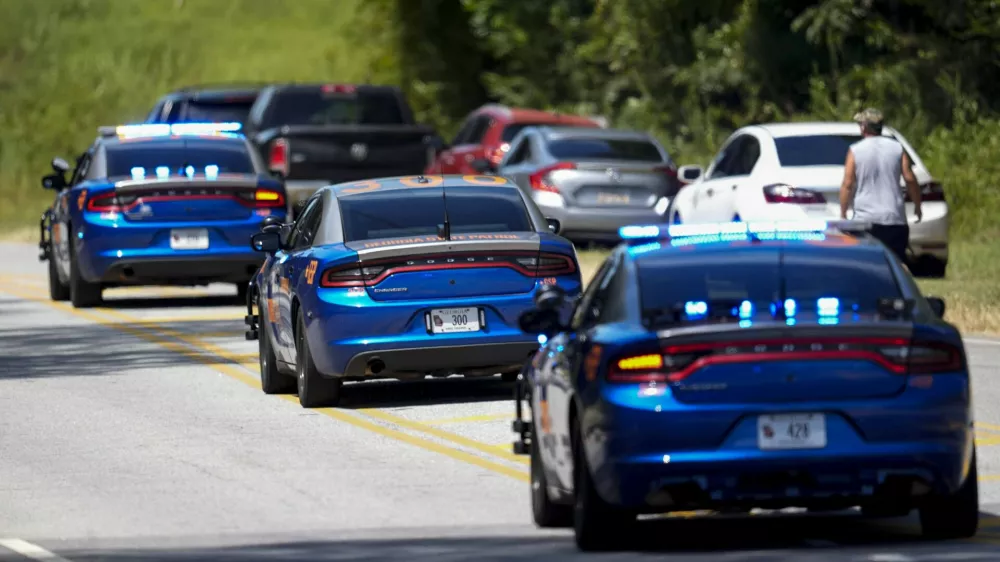 Georgia State patrol vehicles move toward Apalachee High School after a shooting at the school, Wednesday, Sept. 4, 2024, in Winder, Ga. (AP Photo/Mike Stewart)