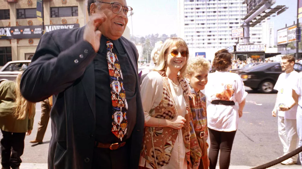 FILE - James Earl Jones, left, greets the press along with his wife Cecilia, center, and son Flynn, right, at the premiere of "The Lion King" in Los Angeles, June 12, 1994. Jones, who overcame racial prejudice and a severe stutter to become a celebrated icon of stage and screen has died at age 93, Monday, Sept. 9, 2024. (AP Photo/Tara Farrell, File)