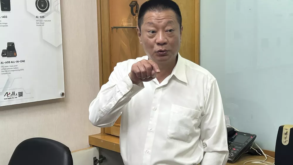 Hsu Ching-kuang, chairman of Apollo Gold, talks about the Taiwan company's communication products at the headquarters in New Taipei City, Taiwan Wednesday, Sept. 18, 2024. (AP Photo/Johnson Lai)