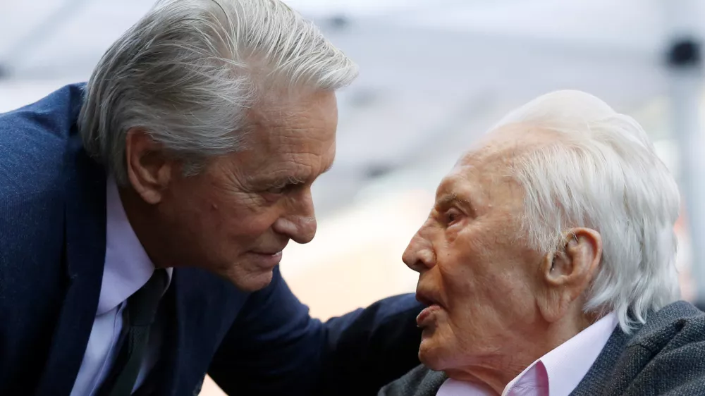 ﻿FILE PHOTO: Actor Kirk Douglas talks with his son actor Michael Douglas prior to the unveiling of Michael Douglas' star on the Hollywood Walk of Fame in Los Angeles, California, U.S., November 6, 2018. REUTERS/Mario Anzuoni/File Photo