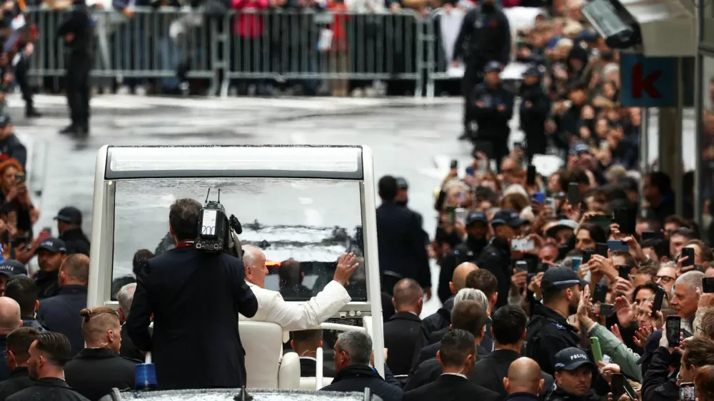 Pope Francis waves from the popemobile, during his one-day apostolic journey in Luxembourg September 26, 2024. REUTERS/Yves Herman