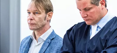 A man, who is a suspect in the disappearance of British toddler Madeleine McCann in Portugal, stands next to his lawyer Friedrich Fuelscher at his trial on unrelated sexual assault charges in Braunschweig, Germany, October 2, 2024. Christian B., is charged with three counts of aggravated rape and two counts of sexual abuse of children in Portugal between June 2007 and December 2000.   Moritz Frankenberg/Pool via REUTERS