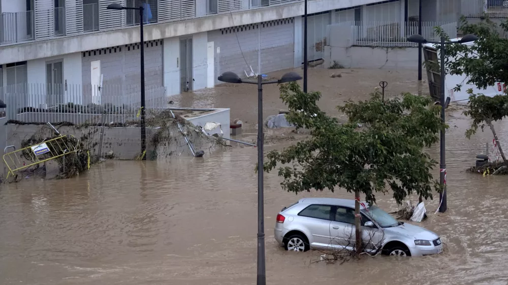 Cars are trapped by flooding in Valencia, Wednesday, Oct. 30, 2024. (AP Photo/Alberto Saiz)