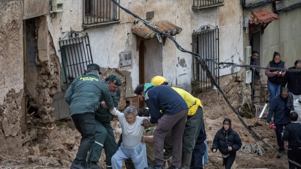 Members of emergency services and Guardia Civil rescue people trapped in their homes after floods in Letur, Albacete, Tuesday, Oct. 29, 2024. (Víctor Fernández/Europa Press via AP)