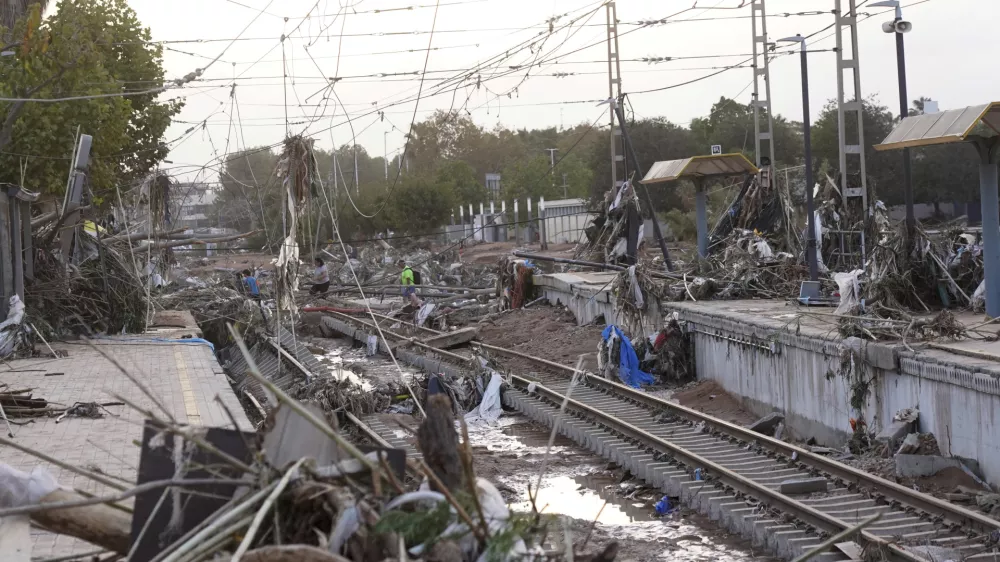 Train tracks are seen affected by floods in Paiporta, near Valencia, Spain, Wednesday, Oct. 30, 2024. (AP Photo/Alberto Saiz)
