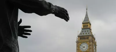 The Big Ben clock tower is pictured behind a sculpture in London May 7, 2010. The Conservatives were in pole position to take power on Friday after winning the most seats in parliament in a bitterly fought election and securing the tentative backing of the the Liberal Democrats. REUTERS/Toby Melville (BRITAIN - Tags: ELECTIONS POLITICS)