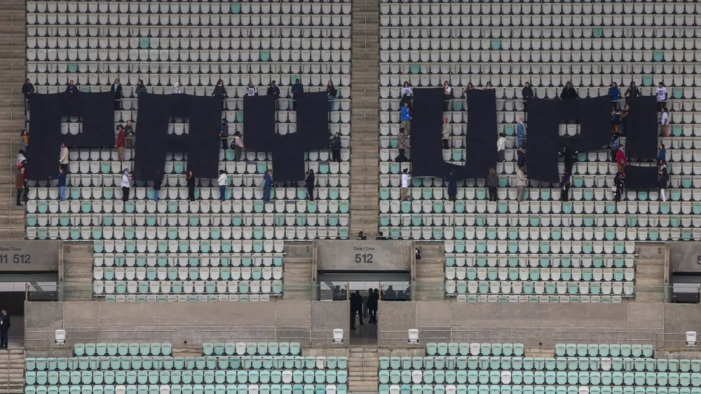 Activists hold a protest calling on developed nations to provide financing to fight climate change at the Olympic Stadium housing the United Nations climate change conference COP29 in Baku, Azerbaijan November 14, 2024. REUTERS/Murad Sezer   TPX IMAGES OF THE DAY