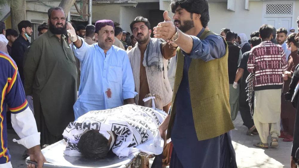 Relatives transport a bodies of the victim of a bomb explosion at railway station, after receiving from a hospital, in Quetta, southwestern Pakistan, Saturday, Nov. 9, 2024. (AP Photo/Arshad Butt)