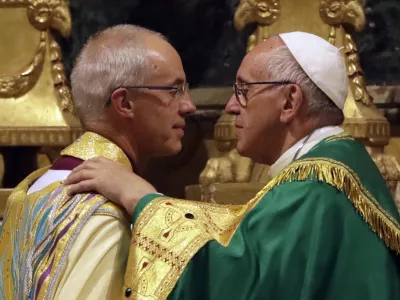 ﻿Pope Francis, right, greets the archbishop of Canterbury, Justin Welby, during vespers prayers in the church of San Gregorio al Celio, in Rome, Wednesday, Oct. 5, 2016. Francis joined the archbishop of Canterbury, Justin Welby, for a vigil prayer service Wednesday at Rome's church of St. Gregory. The church is named for the 6th century pope who dispatched missionaries to England to spread Christianity. (AP Photo/Gregorio Borgia)