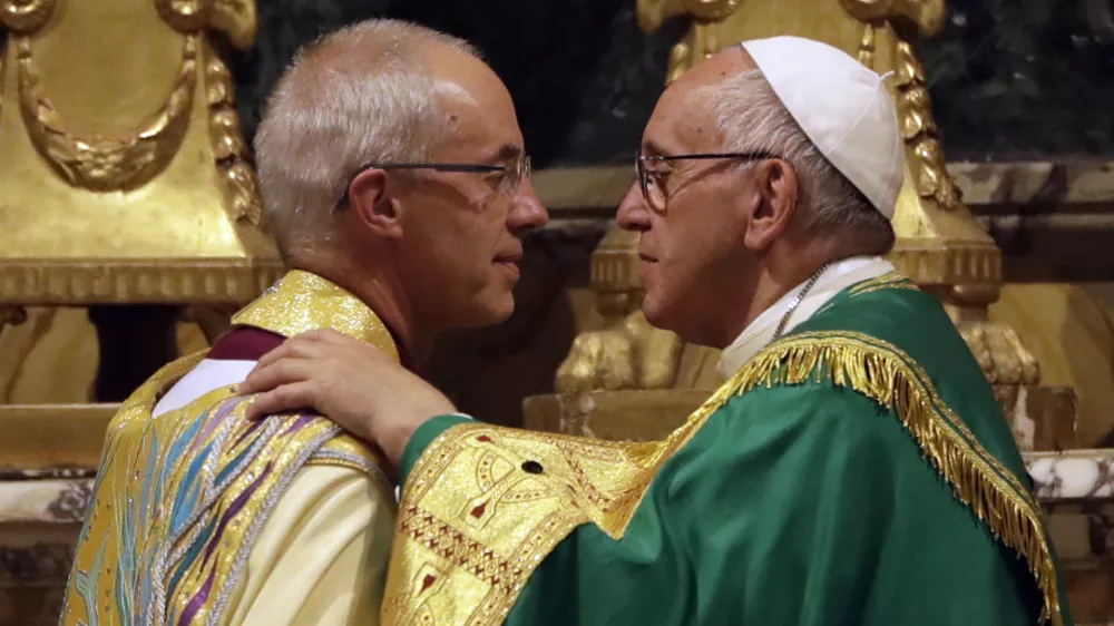 ﻿Pope Francis, right, greets the archbishop of Canterbury, Justin Welby, during vespers prayers in the church of San Gregorio al Celio, in Rome, Wednesday, Oct. 5, 2016. Francis joined the archbishop of Canterbury, Justin Welby, for a vigil prayer service Wednesday at Rome's church of St. Gregory. The church is named for the 6th century pope who dispatched missionaries to England to spread Christianity. (AP Photo/Gregorio Borgia)