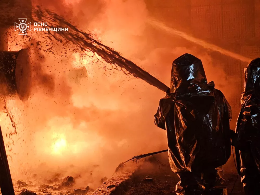 Firefighters work at the site of an energy infrastructure facility hit by a Russian drone strike, amid Russia's attack on Ukraine, in Rivne region, Ukraine December 3, 2024. Press service of the State Emergency Service of Ukraine in Rivne region/Handout via REUTERS ATTENTION EDITORS - THIS IMAGE HAS BEEN SUPPLIED BY A THIRD PARTY. DO NOT OBSCURE LOGO.