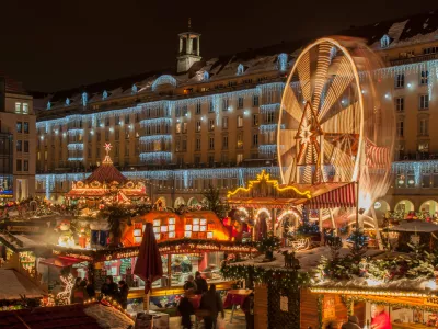 Dresden, Germany - December 20, 2010: An unidentified group of people enjoy Christmas market in Dresden on December 20, 2010 in Dresden, Germany. It is Germany's oldest Christmas Market with a very long history dating back to 1434.