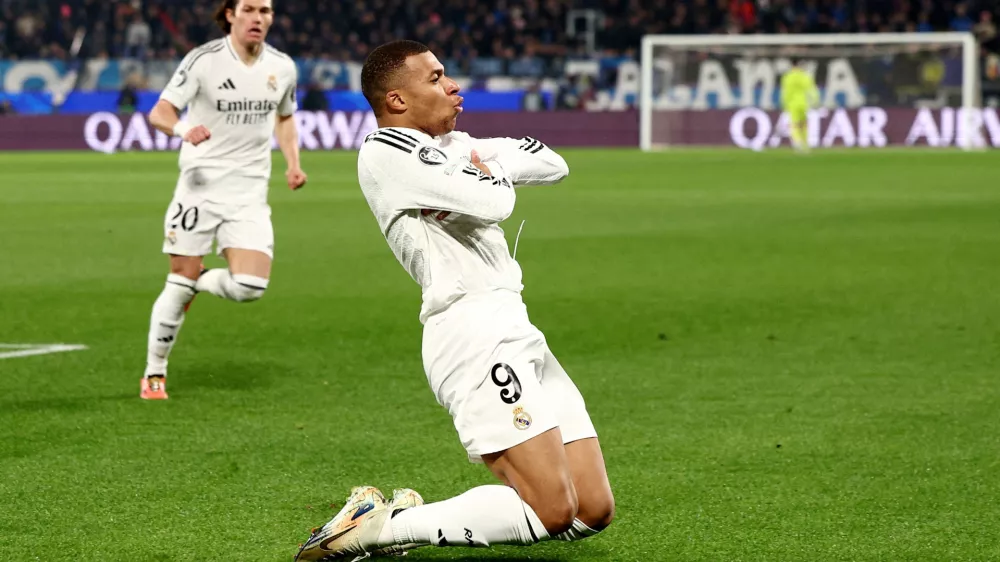 Soccer Football - Champions League - Atalanta v Real Madrid - Gewiss Stadium, Bergamo, Italy - December 10, 2024 Real Madrid's Kylian Mbappe celebrates scoring their first goal REUTERS/Guglielmo Mangiapane   TPX IMAGES OF THE DAY