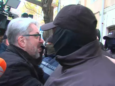 Nika Gvaramia, leader of the Coalition for Change party, is seen surrounded by police officers before his detention in Tbilisi, Georgia December 4, 2024, in this still image from video. Formula TV/Handout via REUTERS ATTENTION EDITORS - THIS IMAGE HAS BEEN SUPPLIED BY A THIRD PARTY. NO RESALES. NO ARCHIVES. MANDATORY CREDIT. GEORGIA OUT. NO COMMERCIAL OR EDITORIAL SALES IN GEORGIA.