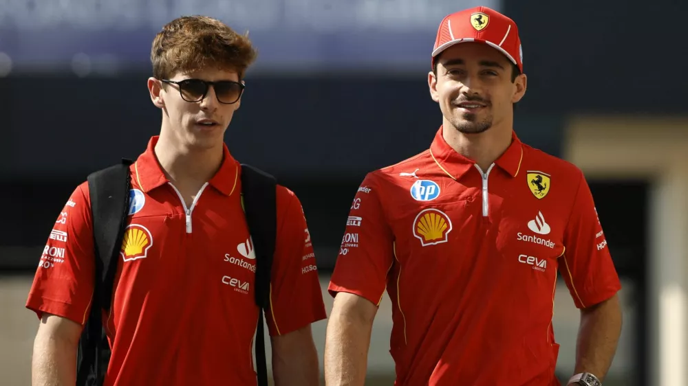 Formula One F1 - Abu Dhabi Grand Prix - Yas Marina Circuit, Abu Dhabi, United Arab Emirates - December 5, 2024 Ferrari's Charles Leclerc and Ferrari test driver Arthur Leclerc ahead of the grand prix REUTERS/Hamad I Mohammed