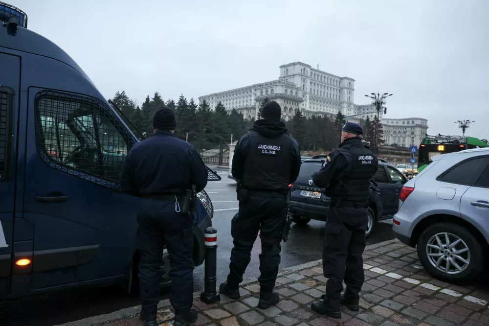 Jandarmeria members stand near the Palace of Parliament, after the Romanian top court annulled the result of the first round of the presidential election, in Bucharest, Romania, December 6, 2024. REUTERS/Louisa Gouliamaki