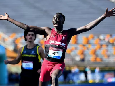 Athletics - Australian All Schools Athletics Championships - Brisbane, Australia - December 6, 2024 Gout Gout of Australia celebrates winning the U18s, 100m final Jono Searle/AAP Image via REUTERS   ATTENTION EDITORS - THIS IMAGE WAS PROVIDED BY A THIRD PARTY. NO RESALES. NO ARCHIVES. AUSTRALIA OUT. NEW ZEALAND OUT